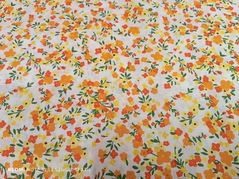 Sárga-narancssárga virágos pamutvászon