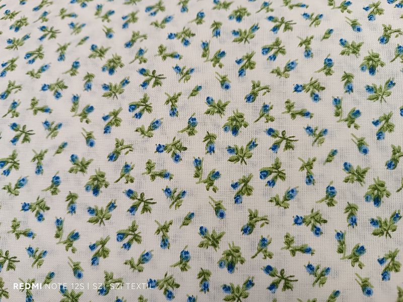 Ekrü alapon kék apró virágmintás pamutvászon